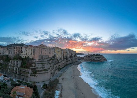 Tropea, Italy, 16 December, 2023: panorama view of Rotonda Beach and the colourful old town of