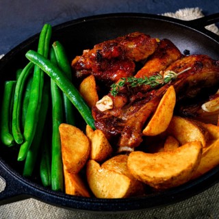 Pork with beans and quarter potatoes