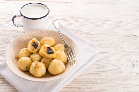 Potato dumplings with plums full
