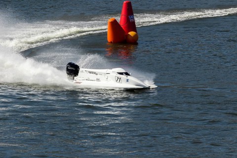 PESO DA REGUA, PORTUGAL - SEPTEMBER 15, 2024: White Powerboat Makes Sharp Turn with Splashes of