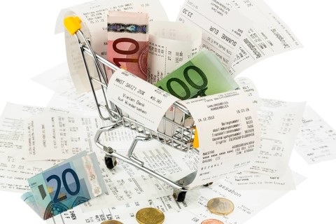 Shopping trolley, banknotes and receipts, symbolic photo for purchasing power, consumption and