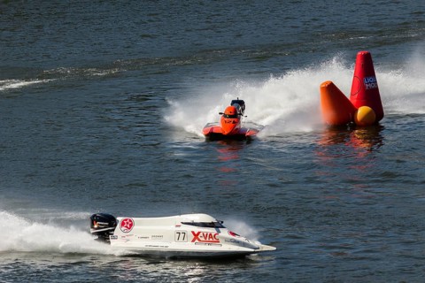 PESO DA REGUA, PORTUGAL - SEPTEMBER 15, 2024: Red and White Powerboats Go Fast with Splashes of