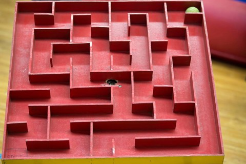 Wooden labyrinth with a ball