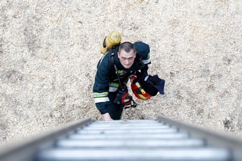 Belarus, Gomel, 04/06/2017, Extinguishing forest fire.Belarus.Firefighter will climb the stairs