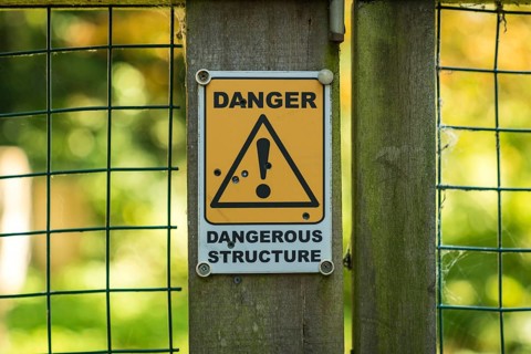 Sign: Dangerous structure, seen in Oare near Faversham, Kent, England, UK