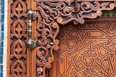 Rich decorated door in an Arab palace in Marrakech, Morocco, Africa