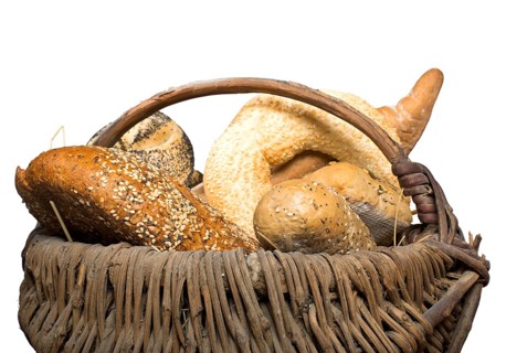 Bread in basket. White isolated