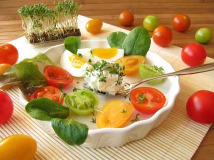 Cream cheese ball with cress, tomatoes and egg