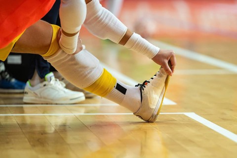 The leg of a futsal player during warm-up