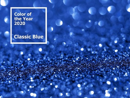 Sparkling background with bokeh made of Classic Blue 2020 color. Color of year 2020 blurred