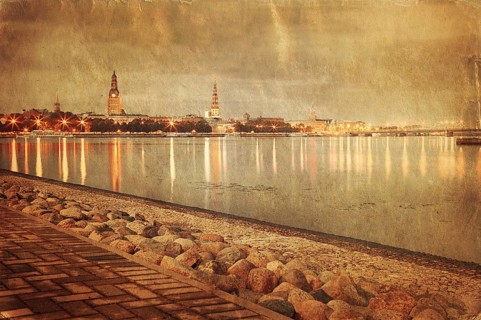 Retro style image of night Riga cityscape. Latvia