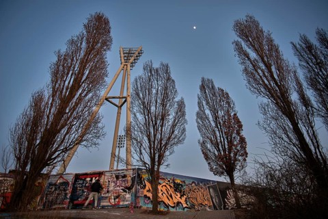 Germany, Berlin, 08.03.2025, Graffiti wall, Mauerpark, floodlight mast of the Cantian Stadium,