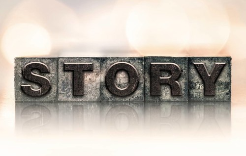 The word STORY written in vintage ink stained letterpress type