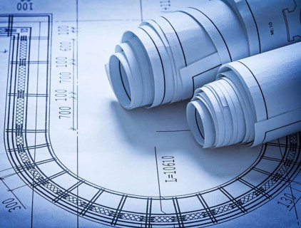 Rolled up construction blueprints building concept