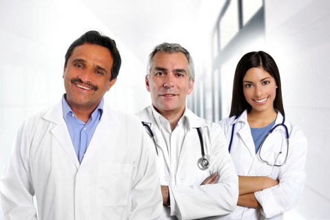 Doctors multi ethnic expertise indian caucasian latin in hospital