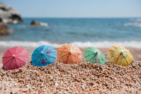 Colorful Chinese paper parasols for shade at the sunny beach
