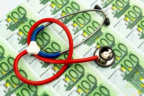 Stethoscope and euro banknotes. Symbolic photo for healthcare costs and for health insurance