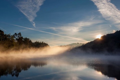 Lake with morning fog Light mood