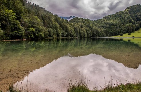 Alatsee, natural lake west of Füssen in the district of Ostallgäu. The lake is up to 35m deep and