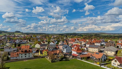 Town view with bright roofs and landscape under a cloudy, blue sky, Mitterteich, Upper Palatinate,