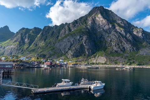 Historic fishing village in front of the mountain landscape of Lofotodden National Park, A i