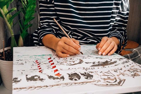 Female hands coloring canvas Picture by numbers Creative hobby. Painting for beginners. Leisure