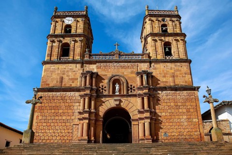 Front view of impressive colonial Cathedral of the Immaculate Conception against blue sky and veil