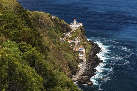 A panoramic view of the Nordeste lighthouse directly on the cliffs of the Azores island of Sao
