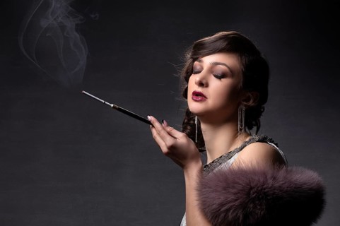 Retro portrait of a woman. A beautiful woman in the style of the 20s and 30s with a cigarette