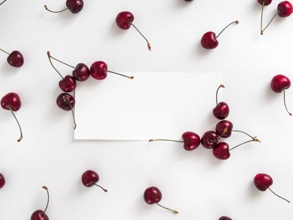 Creative layout with fresh ripe berries. Cherry isolated on white background with white rectangle