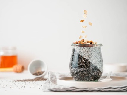 Healthy breakfast concept and idea - two colors chia pudding with organic raw almond. Glass jar