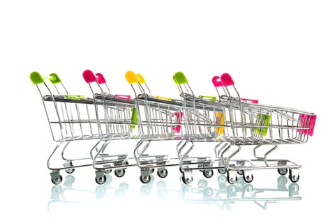 Row empty shopping carts isolated white background