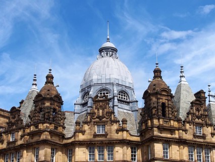 Ornate stone towers and domes on the roof of leeds city market a historical building in west
