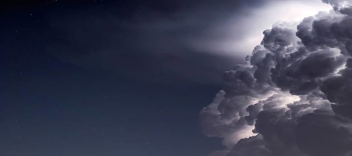 Dramatic Storm Clouds background. Lightning in the clouds. Night Clouds