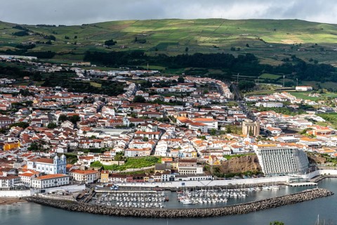 Angra do Heroismo, Portugal, July 1, 2022: Panoramic Aerial View of the old Town and the port of