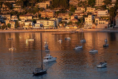 Anchored boats at the sunset, Soller port, Mallorca, Balearic Islands, Spain, Europe