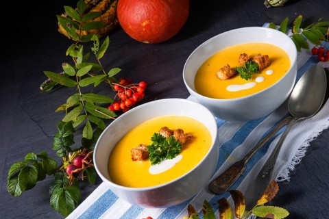 Delicious pumpkin soup with croutons and coconut milk