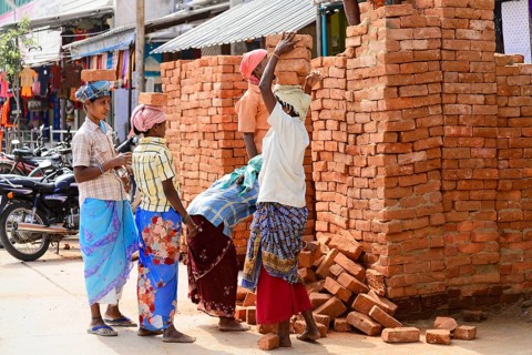 Kanchipuram, Tamil Nadu, South India, India, Asia, Group of labourers stacking bricks on the
