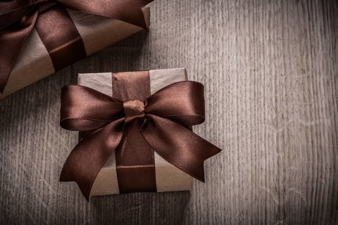 Present boxes with brown ribbons horizontal version celebration concept