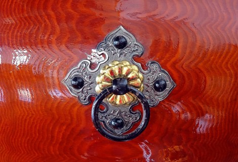 Silver color and brass color bronze fittings on a Japanese wooden Taiku drum