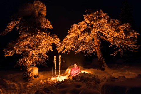 Man around a campfire, Norrbotten, Lapland, Sweden, February 2016, Europe