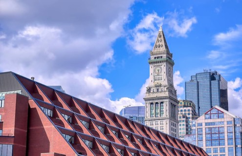 The Custom House Tower along the Boston, Massachusetts skyline on a sunny day