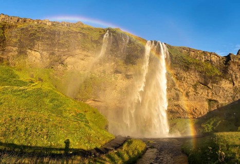 Rainbow at Seljalandsfoss waterfall, South Iceland, Iceland, Europe