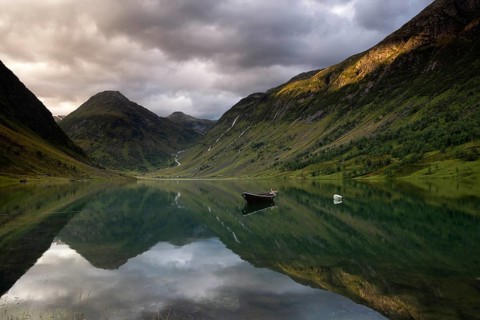 Evening view at Lake Anestolsvatnet which is surrounded by beautiful mountains and is situated
