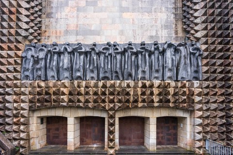 Sculptures of the 14 apostles on the façade, sculptor Jorge Oteiza, and iron doors by Eduardo