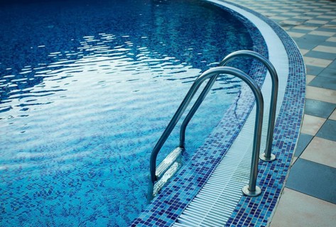 Swimming pool in the resort. View from water