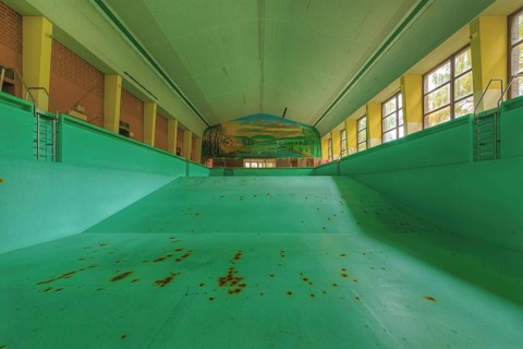Abandoned, empty swimming pool with rust stains and wall painting, Bad am Südpark, Essen-Kray,