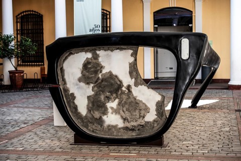 Broken horn-rimmed glasses as a work of art in memory of Salvador Allende Gossens in the courtyard