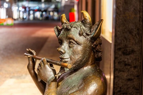 Sculpture, Faun playing flute, night shot, Leoben, Styria, Austria, Europe