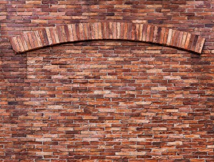 Texture of old red brick wall with an arch, grungy background
